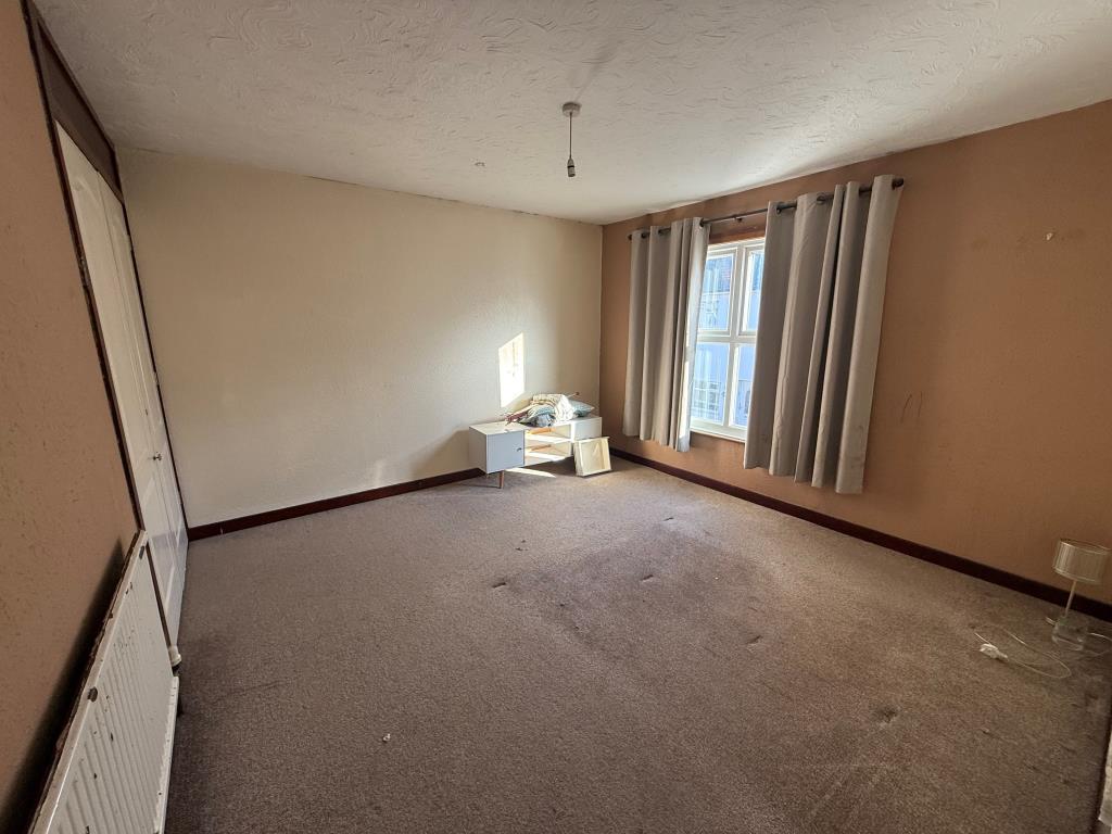 Lot: 141 - DETACHED FOUR-BEDROOM HOUSE FOR IMPROVEMENT - Carpeted bedroom one with window and built in wardrobe